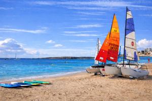 two sailboats and surfboards on a sandy beach at Beachfront Villa Cannes I Garden - Terrace & Sea View -Prime Location- Free Parking in Cannes