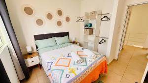 a bedroom with a bed in a room at Casa amplia y privada con alberca para una escapada perfecta in Playa del Carmen