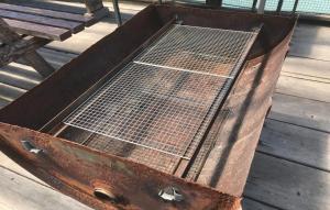 an old rusty chest sitting on a wooden deck at Costa Hinase Resort in Kakui-jima