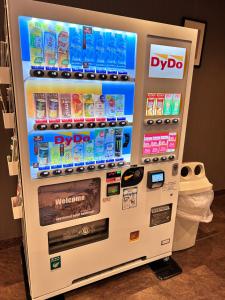 a vending machine filled with lots of energy drinks at Apartment Sunbright in Tokyo