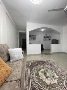 a living room with a couch and a table at Ailynes in Diani Beach