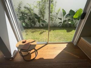 a table in front of a sliding glass door at El Parche Bilinga Beachside, Unit 5, Sleeps 6 in Gold Coast