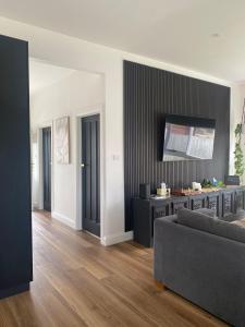 a living room with a couch and a table at Elegant 3br Haven with Character & Charm in Yarram