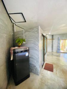a house with a plant sitting on top of a refrigerator at Family view A4 -Kantiang paradise resort- in Ko Bu Bu +18 photos
