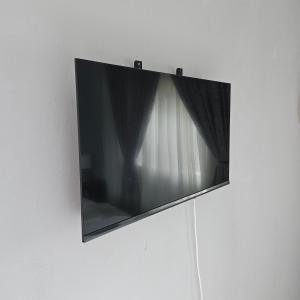 a flat screen tv hanging on a wall at 14 Isabel Room 2 in Centurion