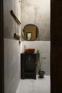 a bathroom with a wooden sink and a mirror at Baan Rim Len Koh Kood in Ko Kood