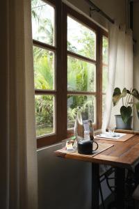 a table in front of a window in a room at Baan Rim Len Koh Kood in Ko Kood +26 photos