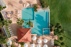 an overhead view of a swimming pool and a house at Wyndham Palmas Beach and Golf Boutique Resort in Humacao