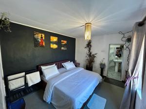 a bedroom with a large bed and a sink at Hidden Treasure in Nuwara Eliya