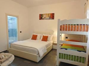 a bedroom with a bed and a bunk bed at Orange City Center in Tirana