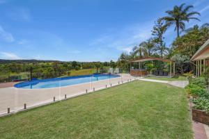 an estate with a swimming pool and a gazebo at Laurelview Scenic Inn Gympie in Gympie