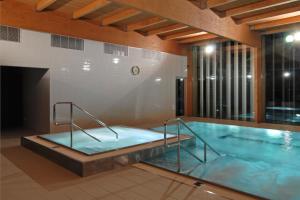a large swimming pool in a building at Park Hotel Tartuf in Beladice +16 photos