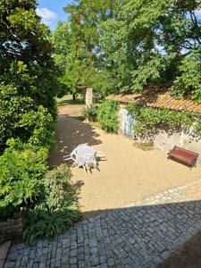 a statue of a zebra on the ground in a park at La Glycine, Maison au calme avec jardin, Fibre Wi-Fi, 20 min des plages, Parking privé in Luçon +30 photos