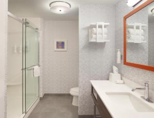 a bathroom with a toilet and a sink and a shower at Hampton Inn & Suites Cleveland-Mentor in Mentor +24 photos