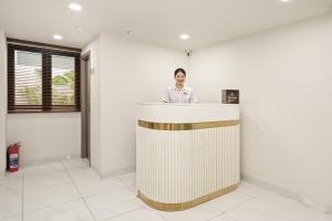 a man standing behind a counter in a room at Soi by La Doma Express in Ho Chi Minh City +142 photos