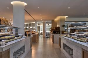a bakery with many different types of food on display at Atlantica Dreams Resort in Gennadi