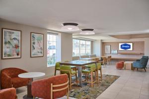 a waiting room with a table and chairs at Hampton Inn & Suites Hermosa Beach in Hermosa Beach