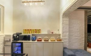 a kitchen with a counter with baskets of food at 대구 더스테이낭만 태전점 in Daegu