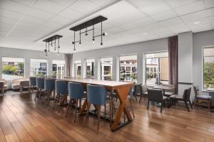 a dining room with a long table and chairs at Hampton Inn & Suites Chicago-Downtown in Chicago