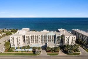 an aerial view of a resort with the ocean at Embassy Suites by Hilton Deerfield Beach Resort & Spa in Deerfield Beach