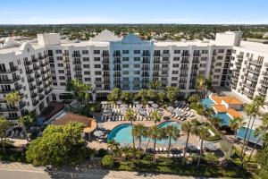 an aerial view of a resort with a pool and resort at Embassy Suites by Hilton Deerfield Beach Resort & Spa in Deerfield Beach