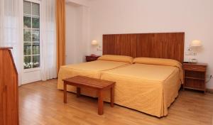 Postel nebo postele na pokoji v ubytování Hotel Valcarce Camino de Santiago