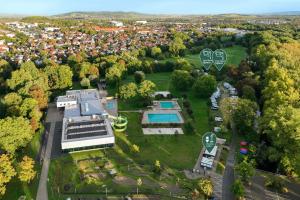 an aerial view of a house with a park at Green&Tiny Spot Wolfenbüttel Okeraue - Sleep Space 1 in Wolfenbüttel