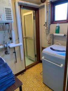a small bathroom with a toilet and a sink at 釧路の夕日に近い宿トラベラーズイン南大通 in Kushiro +38 photos