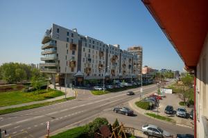 a view of a city street with a large building at Hotel Dominika in Bratislava