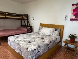 a bedroom with two bunk beds in a room at Pintuyan Dive Resort in Pintuyan +28 photos