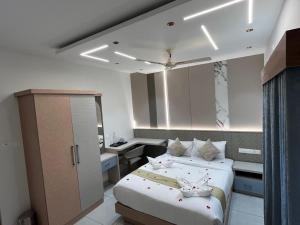 a hotel room with two beds and a desk at Bumblebee Pool Villa Munnar in Anachal +4 photos