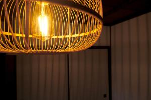 a chandelier hanging from the ceiling in a room at BLUE HOUSE - Traditional Home - 5min, Beach, Bus, Train in Beppu