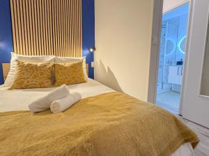a bedroom with a bed with two towels on it at Studio M in Mondeville +4 photos