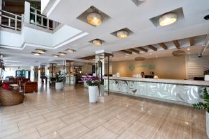 a lobby of a restaurant with a counter at Natural Park Resort Pattaya in Jomtien Beach +103 photos