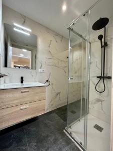 a bathroom with a shower and a sink at Incredible house with garden in Madrid +17 photos