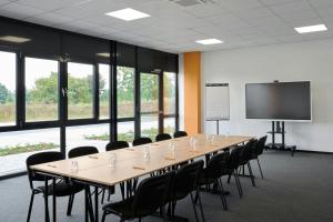 a large conference room with a long table and chairs at Four Points Flex by Sheraton Östringen in Östringen