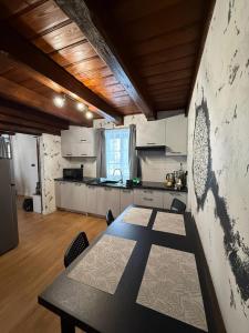 a large kitchen with a table in a room at Domek Ostoja Energylandia Zator Graboszyce in Graboszyce