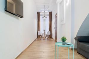 a living room with a couch and a table at FORUM EXPERIENCE Adults Only in Tarragona