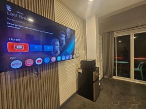 a large screen on a wall in a room at Island Sea One Resort in Panglao Island