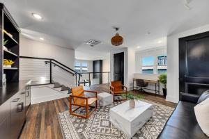 a living room with a couch and a table at Top Floor Penthouse Lofts in Atlanta