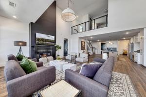 a living room with two couches and a fireplace at Top Floor Penthouse Lofts in Atlanta