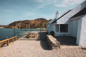 a house with a view of the water at Smiley's Cottage in Doagh