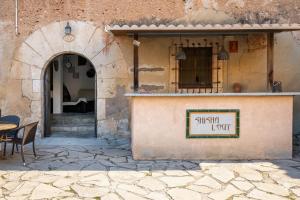 a sign on the side of a building at AT504 Rustic house with private pool in Roda de Bará +23 photos