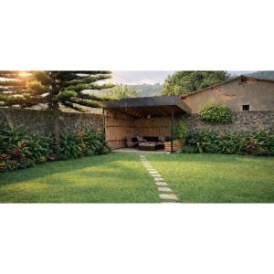 a garden with a pavilion in a yard at COLIBRI VILLA City Center in Gisenyi