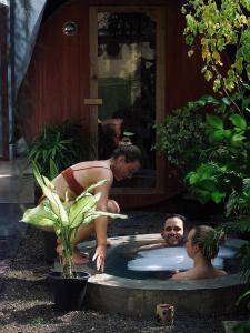 a woman in a bathing suit standing in a hot tub at Cozy Space - Madiha in Matara