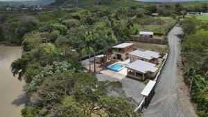 an aerial view of a house next to a river at Las Indgenas 6BR Pool Jacuzzi Gazebo in Imbert