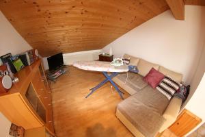 a living room with a couch and a table at Christina's Bergblick in Oberammergau