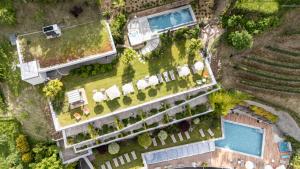an overhead view of a building with a pool at Christophs Hotel in Schenna +30 photos