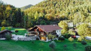 an aerial view of a house in the mountains at Beim Mühltaler III in Schleching
