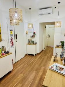 a room with wooden floors and white walls at BluMare ArtHouse in Salerno